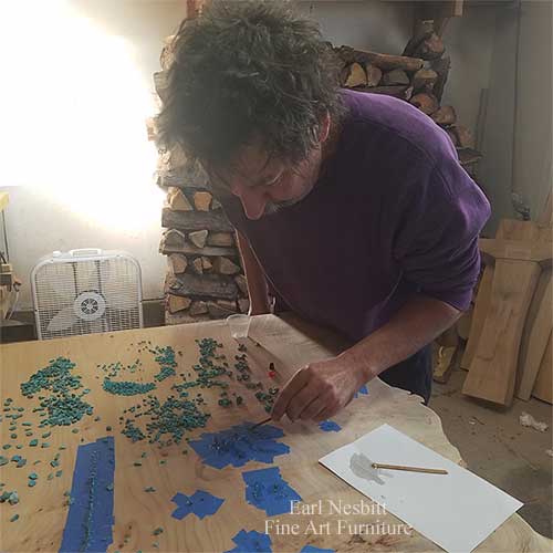 Earl places turquoise in voids of custom maple burl cluster slab